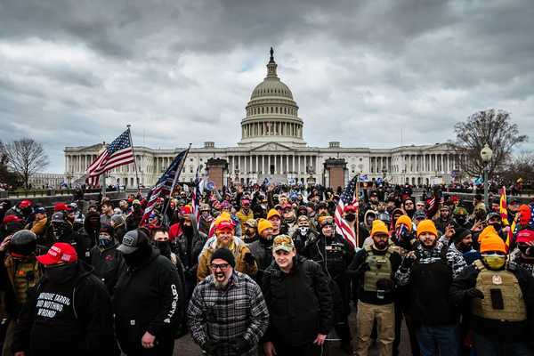 Alt-right insurrectionists in a mixture tactical gear and civilian clothing march against the Capitol on January 6th 2020.